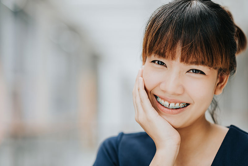 smiling girl with braces